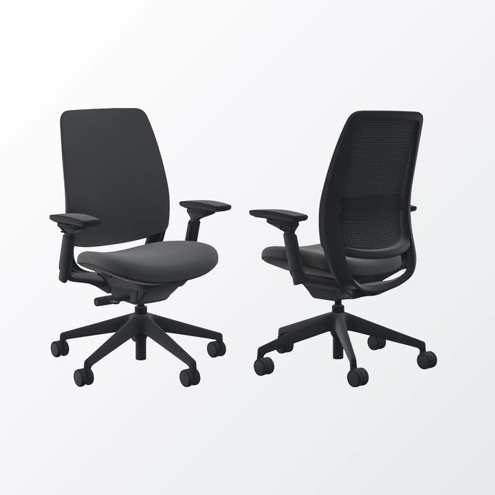 Two black office chairs on a white background