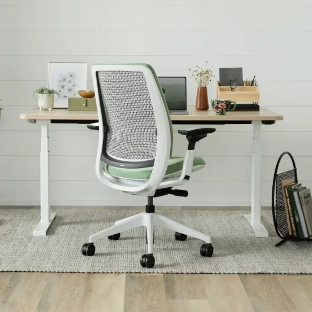 Modern office chair in a home office setting with a desk and decor.